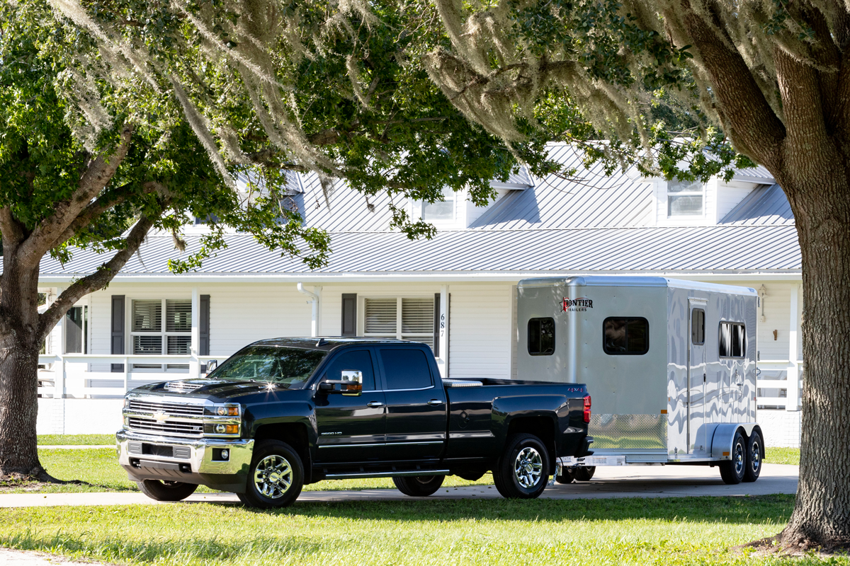 Ambassador 67" Lite BP Straight Load Series Grey Trailer In Front Of White House